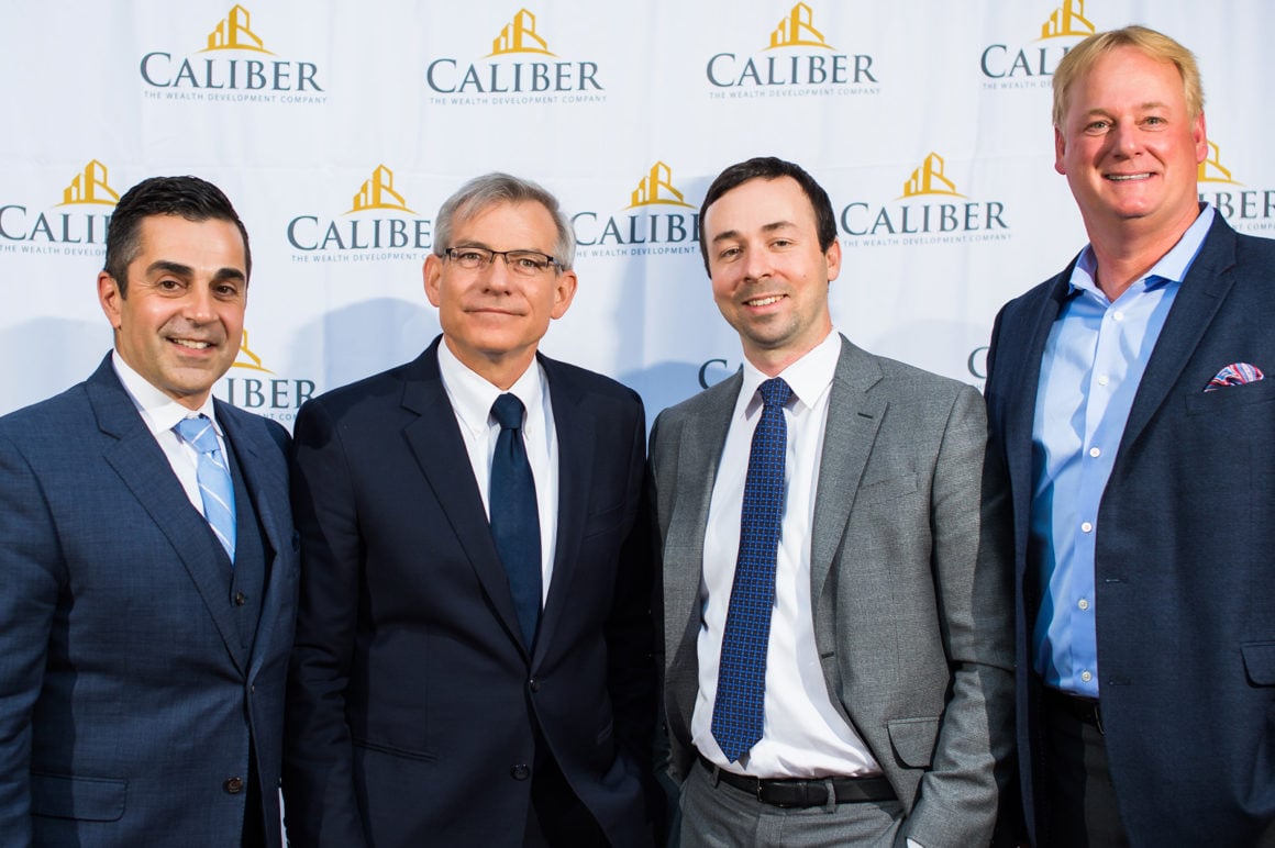 From right: Caliber's Roy Bad and Chris Loeffler pose with Congressman David Schweikert