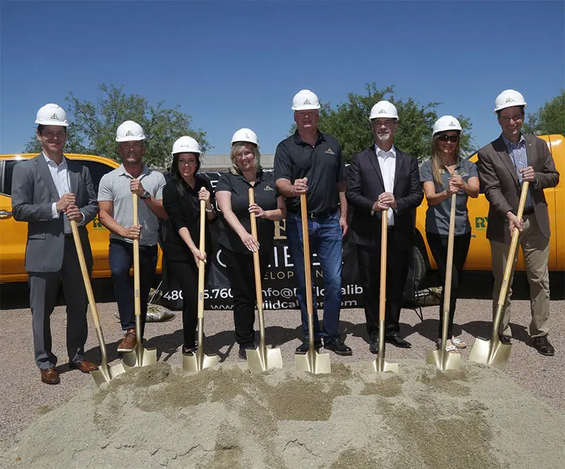 Groundbreaking in Tucson with Team in hard hats and with shovels